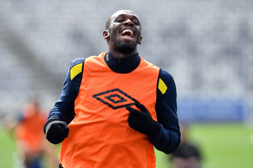 Olympic champion Usain Bolt trains with A-League football club Central Coast Mariners in Gosford. Photo: AFP