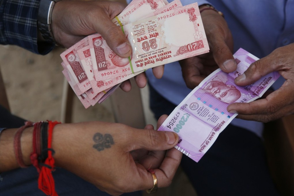 India's central bank says nearly all of the currency removed from circulation in a surprise 2016 attempt to root out illegal hoards of cash has came back into the financial system. Photo: AP