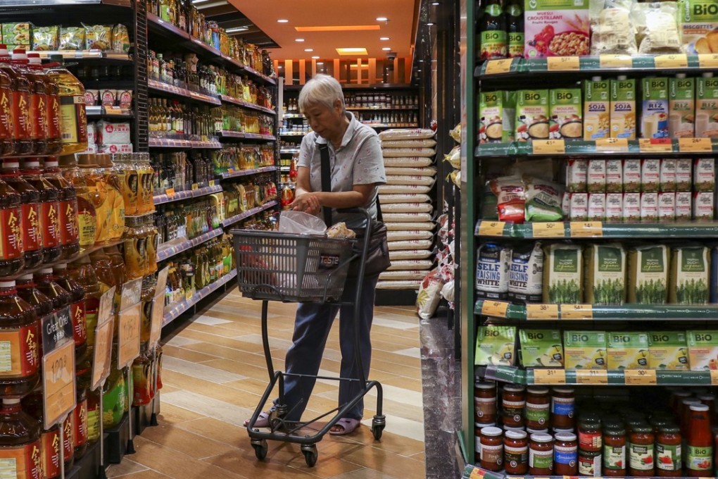 A woman shops in a supermarket in Kowloon Bay on August 2. Photo: Roy Issa