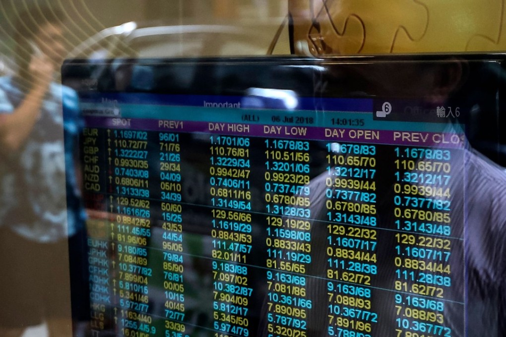 A brokerage in Hong Kong. The turnover on the Hong Kong stock exchange’s main board was 17 per cent lower on Thursday than on Monday. Photo: AFP