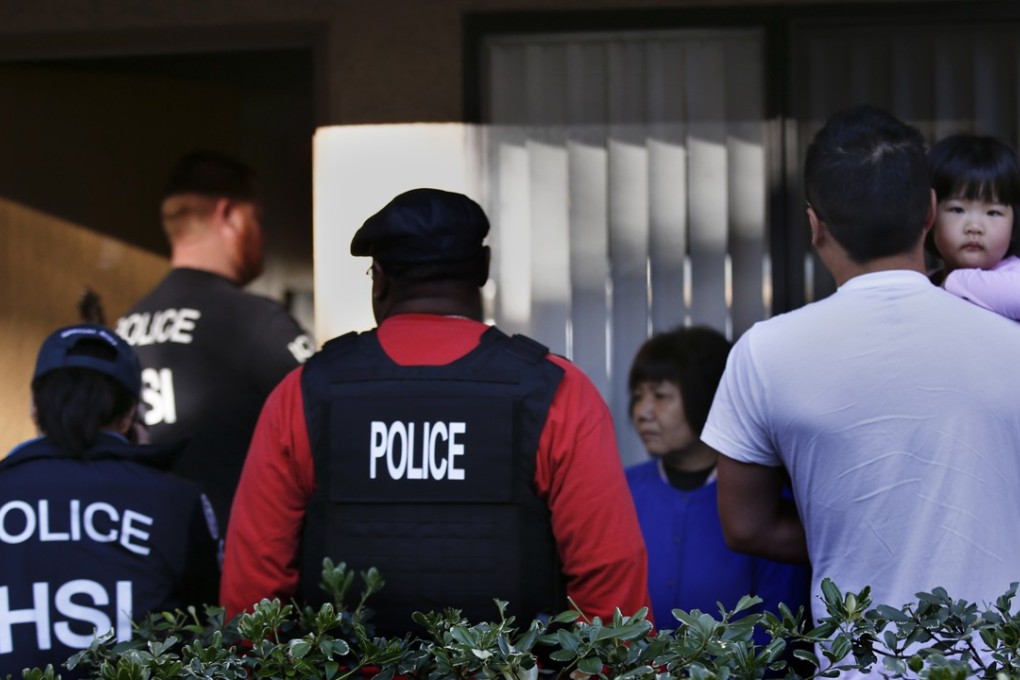 Police investigate a complex in California suspected of being a “maternity hotel”, where Chinese women board to give birth on American soil, in 2015. Picture: Mark Boster / Los Angeles Times