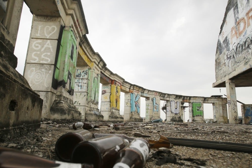 The Sathorn Unique Tower in Bangkok was planned as a luxury condominium complex, but abandoned when the Asian financial crisis struck in 1997. Now known as a “ghost tower”, it is a monument to past mistakes and an object of curiosity. Photo: AP