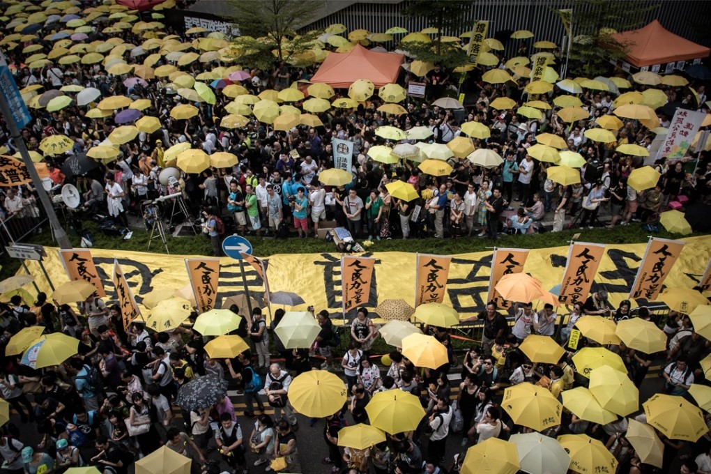 Pro-democracy demonstrators and activists gather outside government headquarters in 2015 to mark the first anniversary of the Occupy protest. Photo: AFP