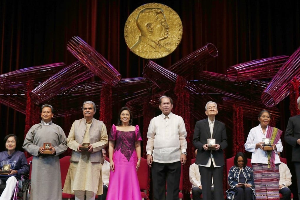 The 2018 Ramon Magsaysay awardees pose with the Philippines’ vice-president Leni Robredo, fourth from left, and Senen Bacani, chair of the board of trustees, fifth from left, in Manila. From left: Vo Thi Hoang Yen, Vietnam; Sonam Wangchuk, India; Bharat Vatwani, India; Robredo; Bacani; Howard Dee, the Philippines; Maria Lourdes Martins Cruz, Timor Leste; Youk Chhang, Cambodia. Photo: AP