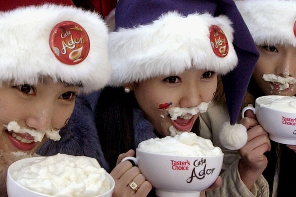 South Korean models drink coffee during a promotional event in Seoul. The government has banned coffee in the country’s schools for health reasons. Photo: AFP