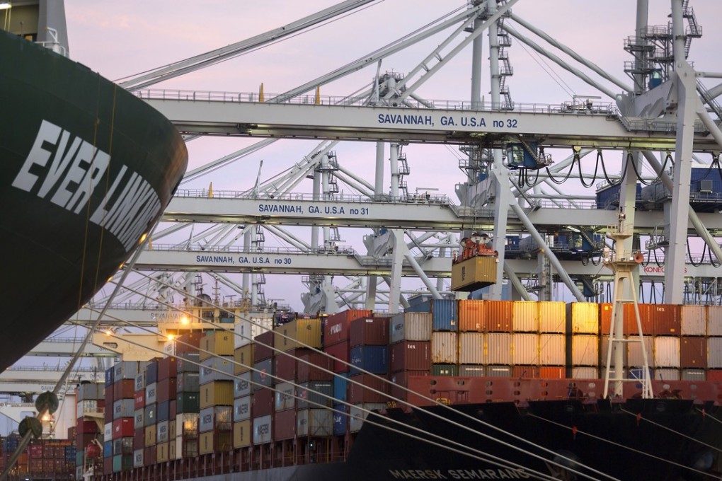 Cranes stack shipping containers on-board the ship Maersk Semarang at the Port of Savannah in Savannah, Ga. Photo: AP