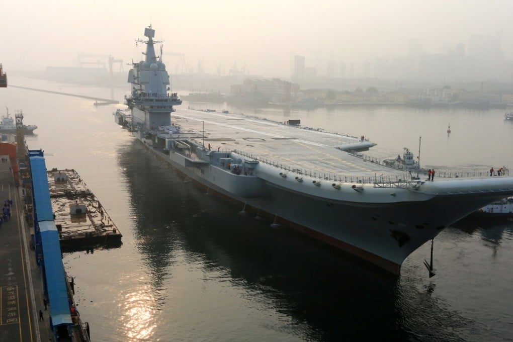 The 001A aircraft carrier leaving Dalian for its first sea trial in May. Photo: Reuters
