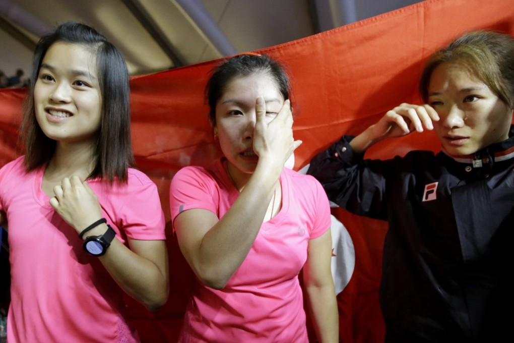 Hong Kong's Lee Ka-yi, Annie Au and Joey Chan Ho-ling are emotional after winning gold in the women’s squash team competition in Jakarta. Photo: AP