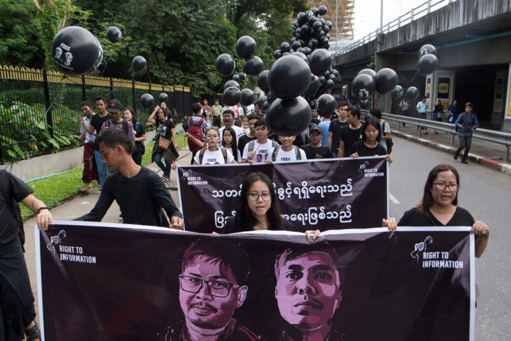Supporters of detained Myanmar journalists Wa Lone and Kyaw Soe Oo march during a rally in Yangon on Saturday demanding for their release. Photo: AFP