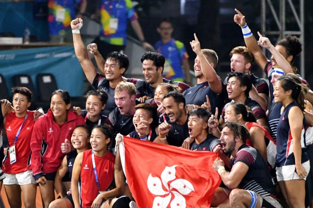 The Hong Kong rugby sevens men’s team with their support staff after winning gold at the Asian Games. They beat nemesis Japan in the final in Jakarta. AFP