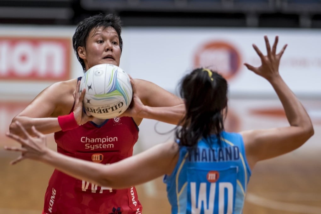 Connie Wong prepares to pass for Hong Kong against Thailand. Photos: Netball Singapore