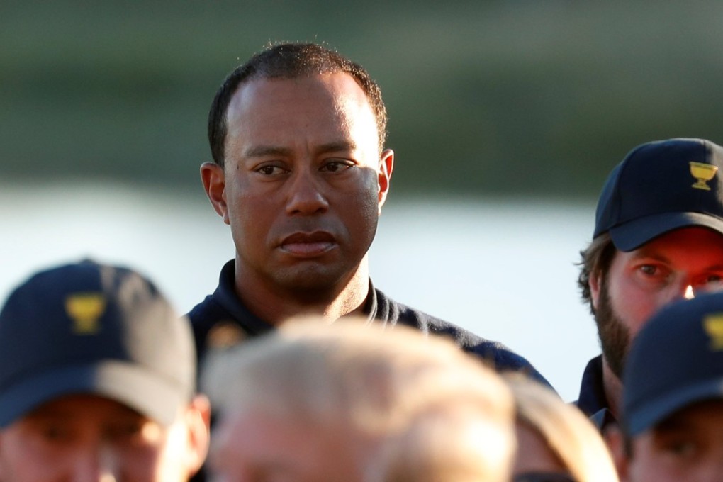 Tiger Woods watched as US President Donald Trump congratulated players before presenting the trophy to the US team at the conclusion of the Presidents Cup golf tournament at Liberty National Golf Club in Jersey City, New Jersey, in 2017. Photo: Reuters