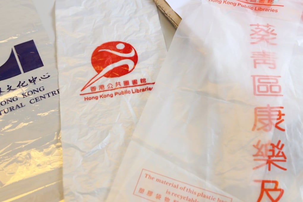 Plastic umbrella covers showing the names and logos of government venues. Photo: K.Y. Cheng