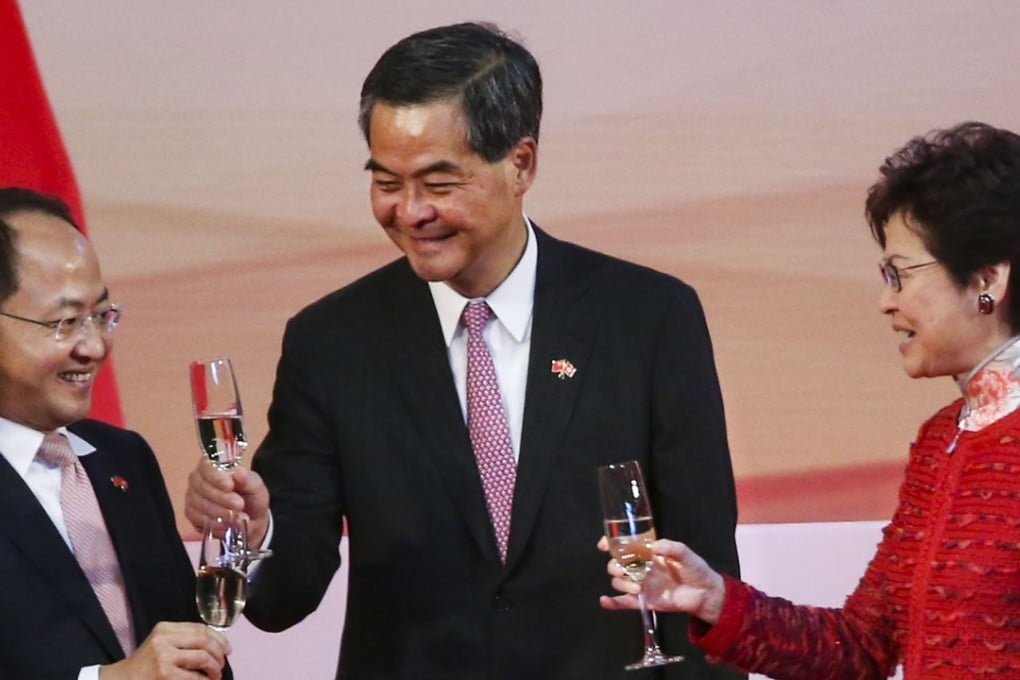 Wang Zhimin, director of the Central Government's Liaison Office (left), Leung Chun-ying, former chief executive (centre), and Chief Executive Carrie Lam Cheng Yuet-ngor, raise a glass to celebrate National Day. Photo: K.Y. Cheng