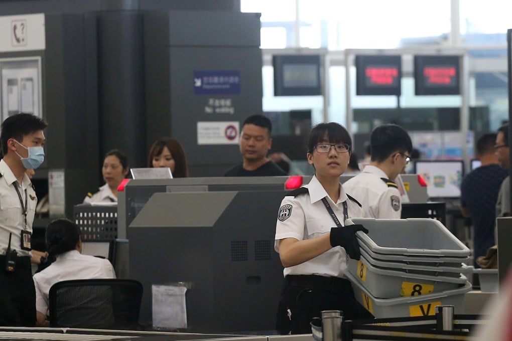 According to the new rules in Hong Kong, a carry-on bag can be screened without the passenger present. Photo: David Wong