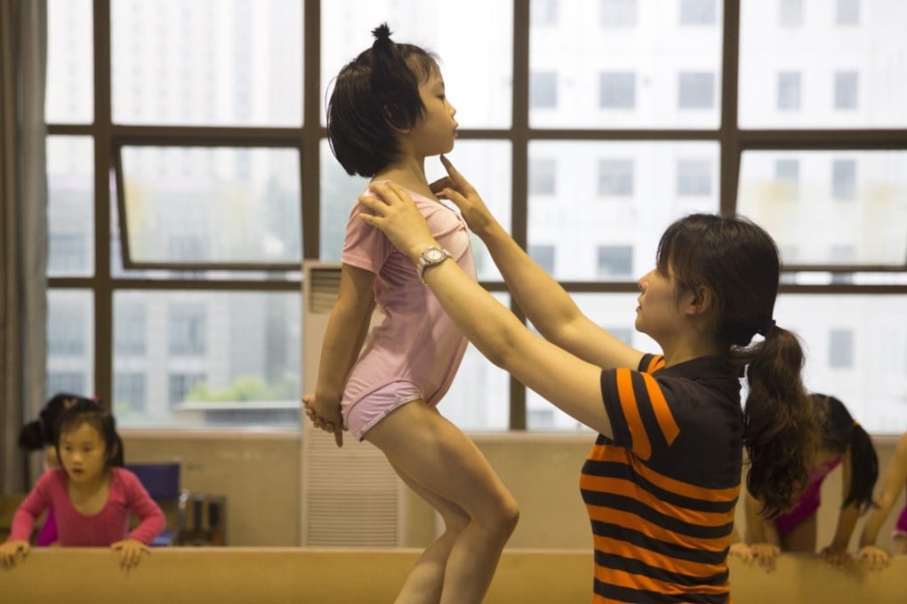 A young gymnast trains at the Xuhui Sports School in Shanghai, China. Photo: AP