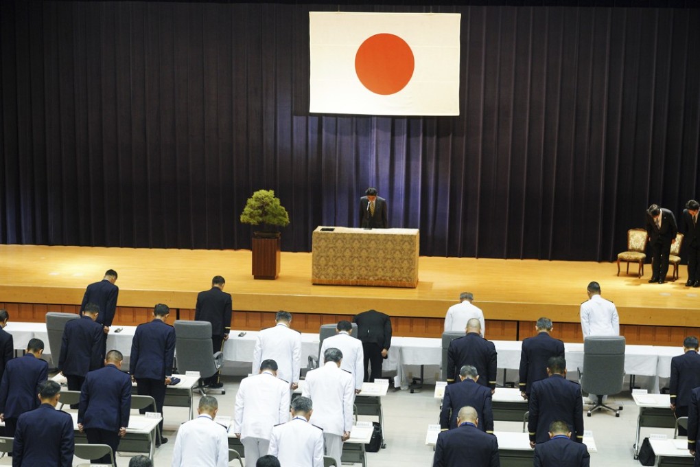 Japanese Prime Minister Shinzo Abe, top, and Japan Self-Defence Forces senior officers at the defence Ministry in Tokyo on Monday. Abe expressed his concern over the security environment surrounding Japan getting more severe. Photo: AP