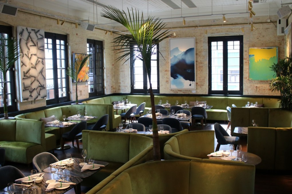 The cool and breezy interior at Madame Fu, with its palm tree, is a nod to roaring 20s Shanghai, as are the desserts on the menu.