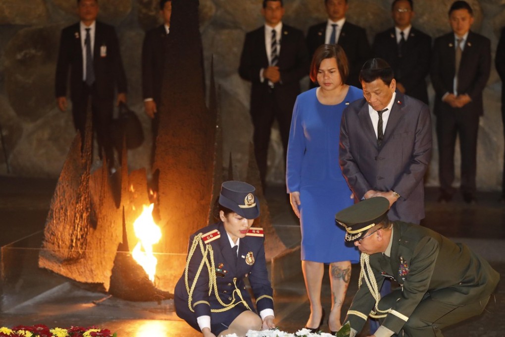 Philippine President Rodrigo Duterte, right, and his daughter Sarah lay a wreath at the hall of remembrance at the Yad Vashem Holocaust memorial museum in Jerusalem on Monday. Photo: EPA-EFE
