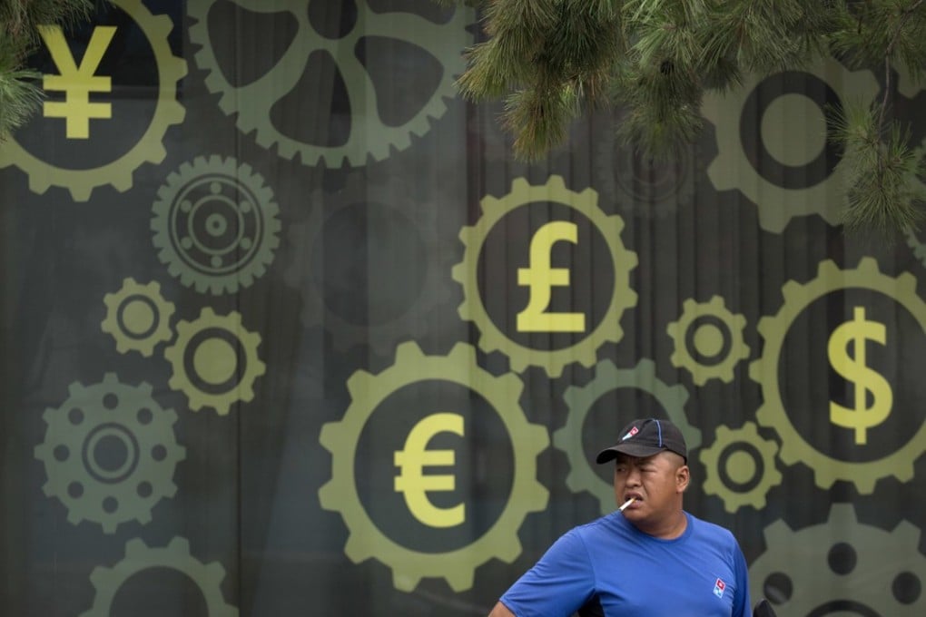 A delivery man takes a break near a mural displaying world currency symbols on the outside a bank in Beijing on July 20. China’s central bank confirmed that the “counter-cyclical factor” mechanism has been reintroduced to ease downward pressure on the yuan. Photo: AP