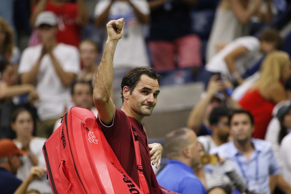Roger Federer waves to the crowd as he leaves the court after losing to John Millman. Photo: AP