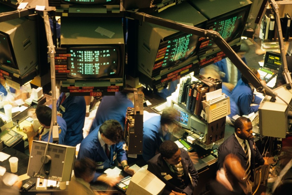 Floor traders at the New York Stock Exchange on August 19, 2018. Photo: ALAMY