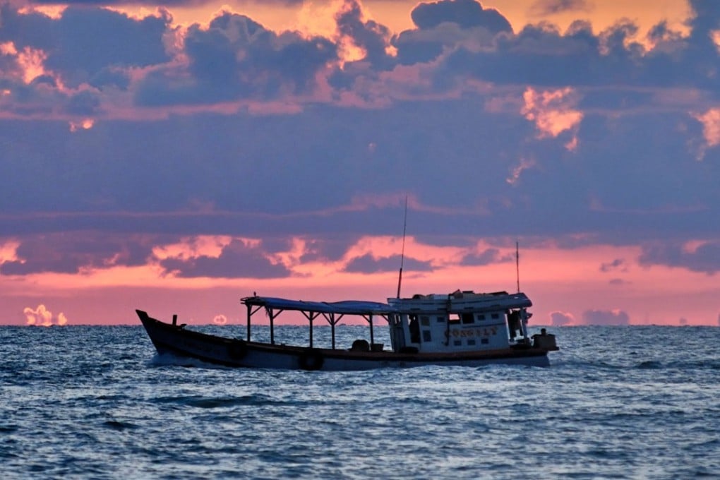 A fishing boat at sunset off the coast of Phu Quoc in Vietnam. Photo: Alamy