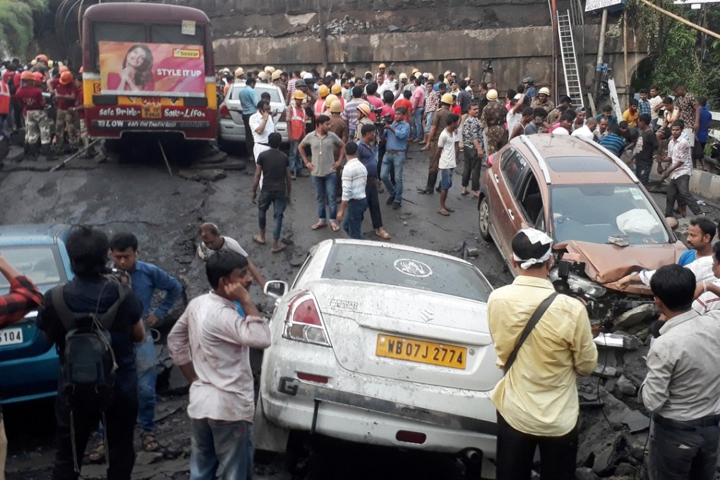 Firefighters and rescuers search for victims at the site of a bridge that collapsed in Kolkata. Photo: Reuters