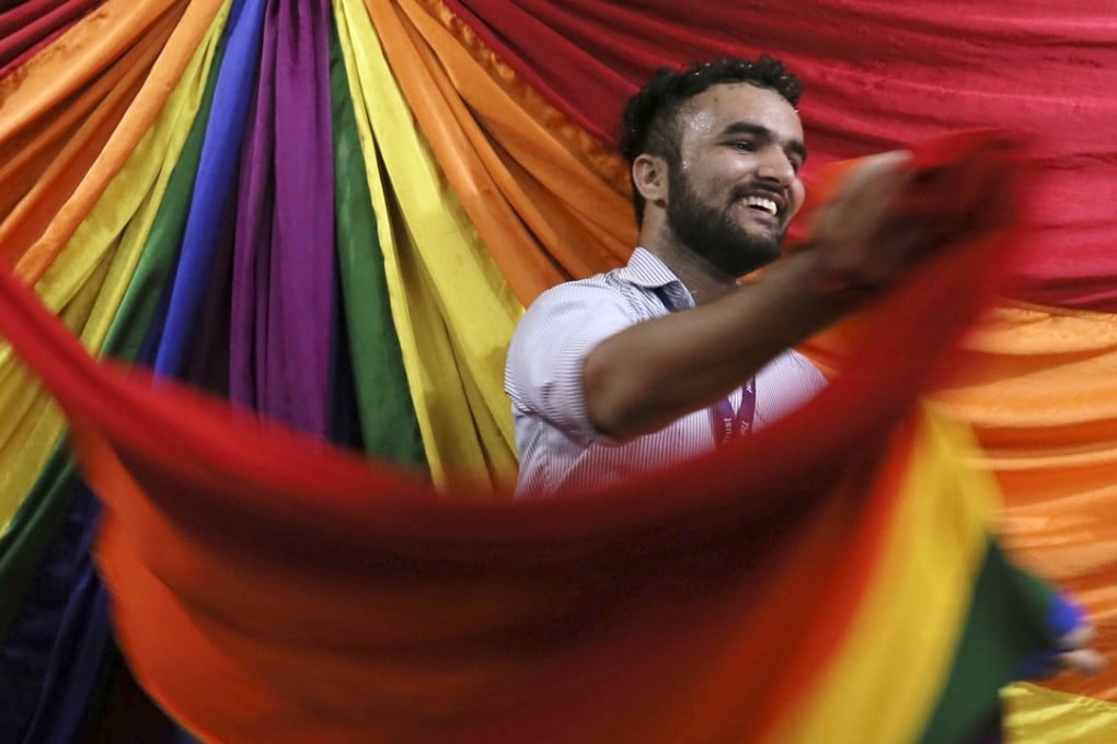 An Indian LGBT activist reacts after a Supreme Court hearing ruled that gay sex is no longer a criminal offence. Photo: EPA