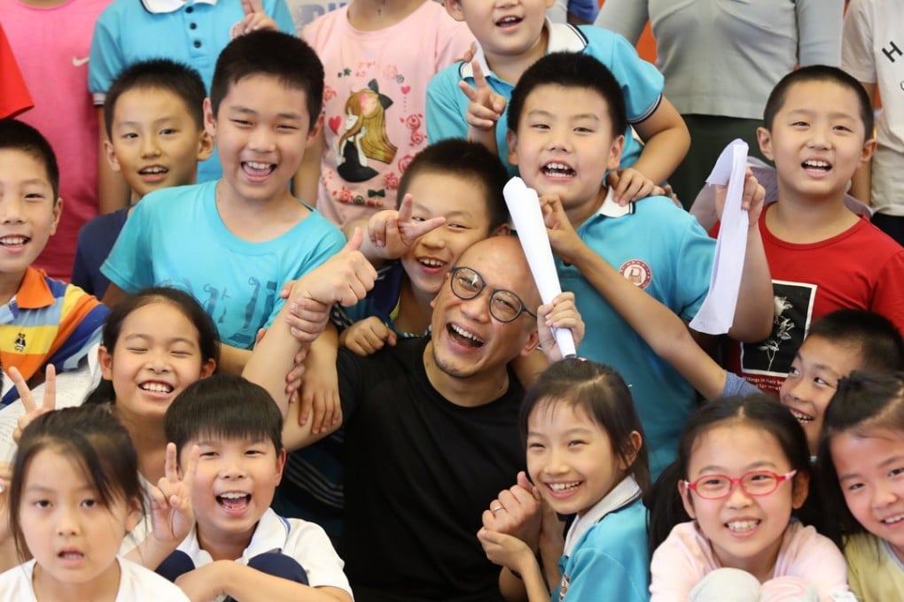 William Yip, who set up a theatre troupe in Hong Kong before moving to Beijing, with children from his dance class at a primary school in the capital. Photo: Simon Song