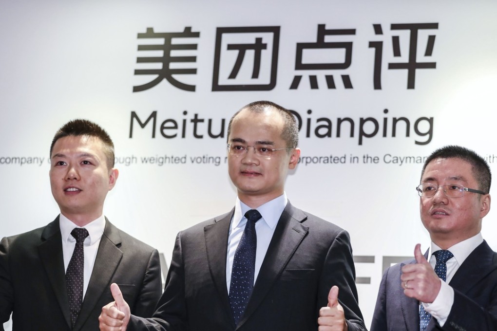 Meituan Dianping (L-R): Chief Financial Officer and Senior Vice President, Chen Shaohui; Co-founder, Chairman, and Chief Executive Officer, Wang Xing; and Co-founder and Senior Vice President, Wang Huiwen pose for the media before the company’s global offering investor lunch presentation at the Grand Hyatt Hotel in Wan Chai. Photo: SCMP