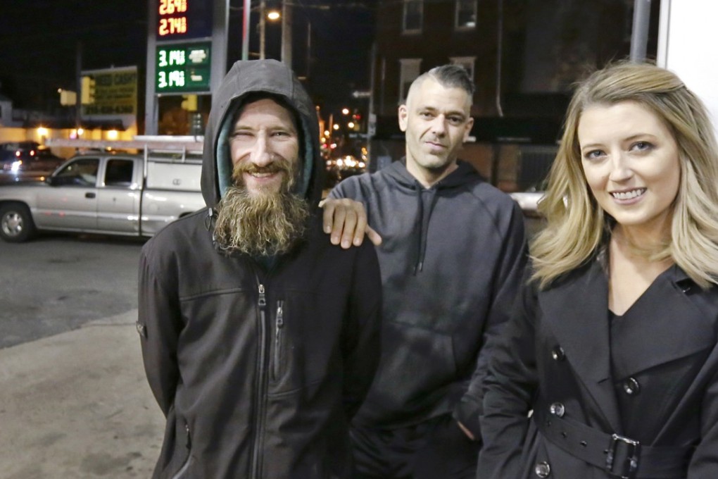 In this November 17, 2017, file photo, Johnny Bobbitt Jnr, left, Kate McClure, right, and McClure's boyfriend Mark D'Amico pose at a Citgo service station in Philadelphia. Bobbitt, a homeless man whose selfless act of using his last US$20 to fill the gas tank of a stranded motorist in Philadelphia drew worldwide attention. Photo: TNS
