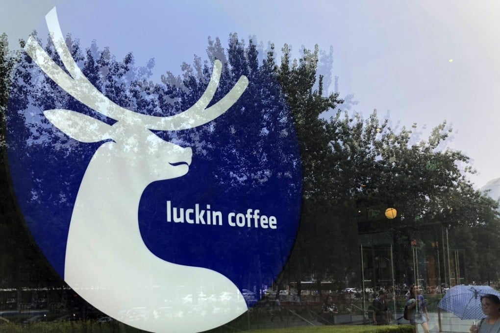 The logo of Chinese coffee chain 'Luckin coffee' is pictured on the window of a Luckin Coffee shop in Beijing, China, on August 02, 2018. 02AUG18 SCMP/Simon Song