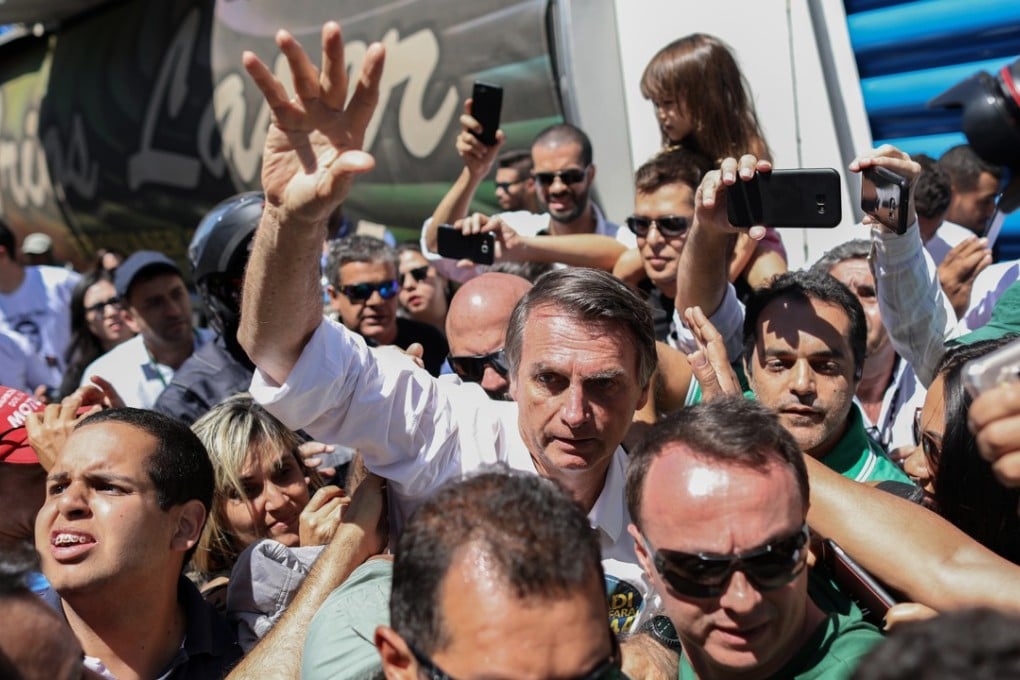 Jair Bolsonaro waves to supporters during a campaign rally at Taguatinga, Brazil, on Wednesday, September 5, 2018. Photo: Bloomberg