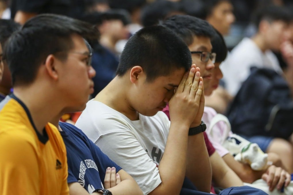 Queen’s College students anxiously await their DSE exam results on July 11. Their exam scores determine their chances of getting into sought-after courses in publicly funded universities. Photo: Nora Tam
