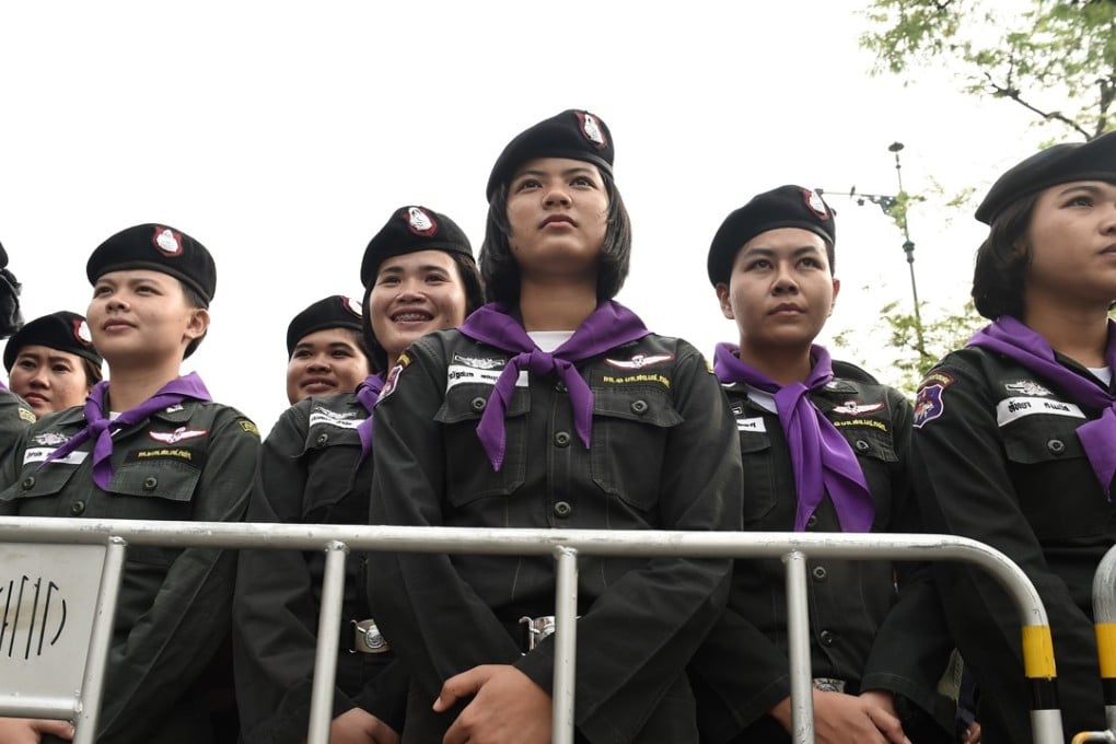 A phalanx of Thai police women at Thammasat University during a protest to mark the fourth year of junta rule in Bangkok on May 22. A key police training academy has banned female cadets. Photo: AFP