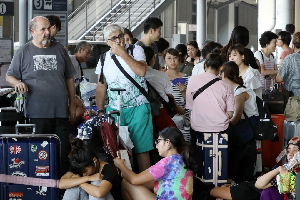 Passengers stranded at Kansai International Airport outside Osaka, Japan. Photo: EPA-EFE