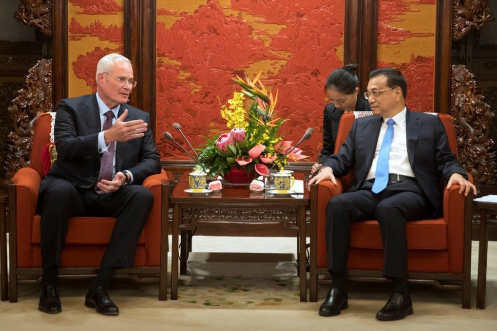 ExxonMobil chief Darren Woods and Chinese Premier Li Keqiang meet at the Zhongnanhai Leadership Compound in Beijing on Friday. Photo: Reuters