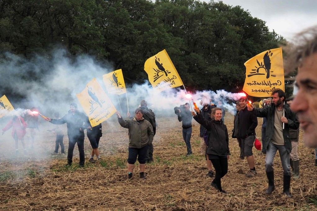 Protesters demonstrate against ‘land grabs’ by Chinese investors, in Murs, near Chatillon-sur-Indre, France. Photo: AFP