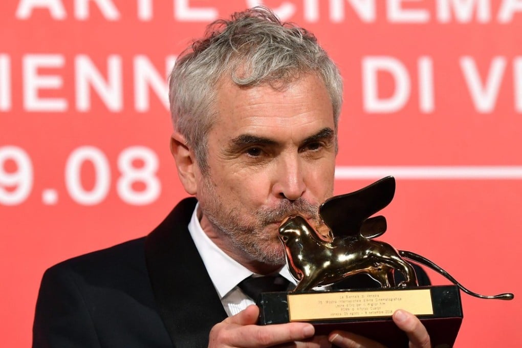Mexican director Alfonso Cuarón holds the Golden Lion award for his movie 'Roma'. Photo: EPA