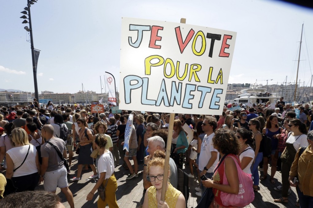 A woman with a placard that reads “I vote for the planet”, during a demonstration for the climate, in Marseille, France, on Saturday. The march was part of a global day of protest ahead of a climate action summit later this month in San Francisco, California. Photo: AP