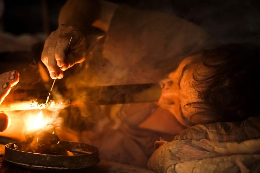 Hmong tribesman Vo Pali: ‘It has damaged my life. I have no income. But I get sick without it’. Photo: AFP