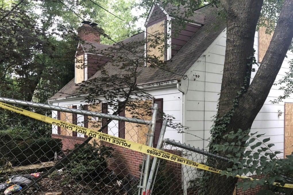 Police tape surrounds the house where Askia Khafra died in a fire while digging underground tunnels for a secret nuclear bunker for stock trader Daniel Beckwitt. Photo: AP