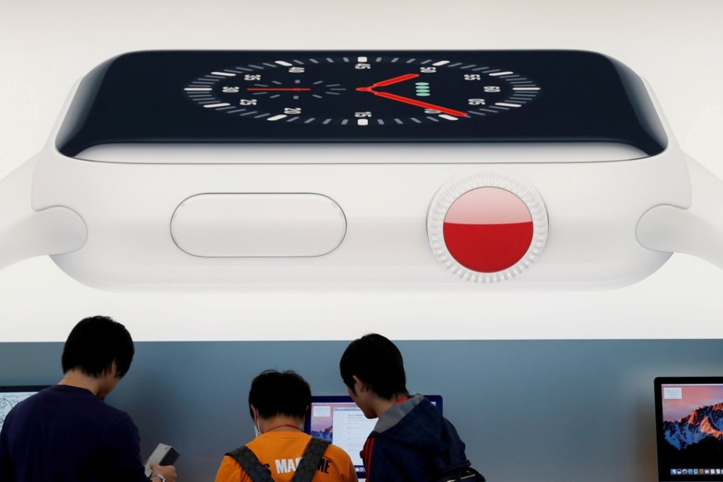 Customers at an Apple Store in Tokyo in 2017. Photo: Reuters
