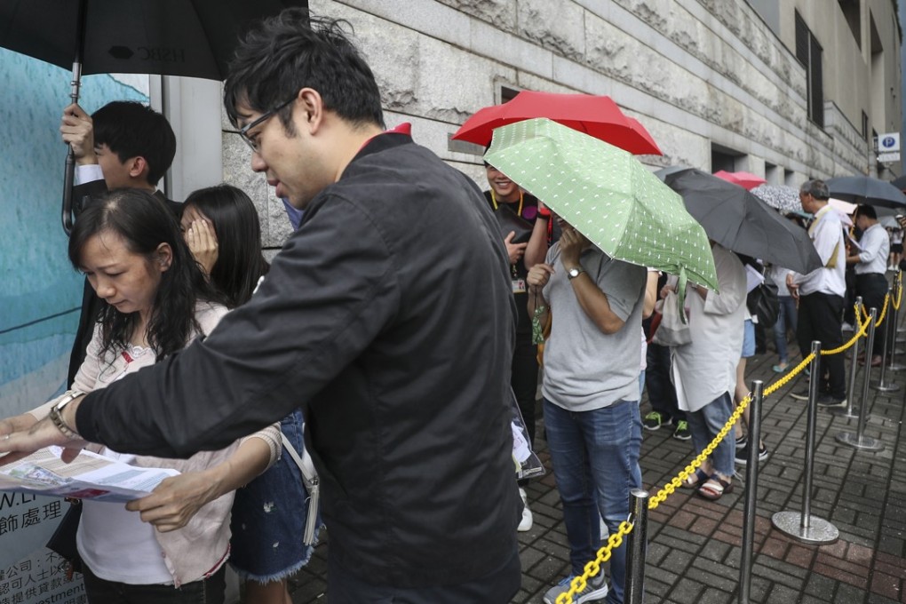 Nan Fung Development's LP6 project in Lohas Park attracted long queues of buyers at Octa Tower in Kowloon Bay, who braved a thunderstorm to snap up the units on offer on 8 September 2018. Photo: SCMP/Edward Wong.