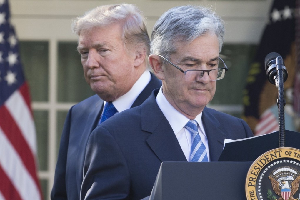 US President Donald Trump (back) hands over the podium to Jerome Powell after announcing him as his nominee for chair of the board of governors of the Federal Reserve, at the White House in Washington on November 2, 2017. Trump has criticised Powell for raising interest rates last month, contributing to the dollar’s strength. Photo: EPA-EFE
