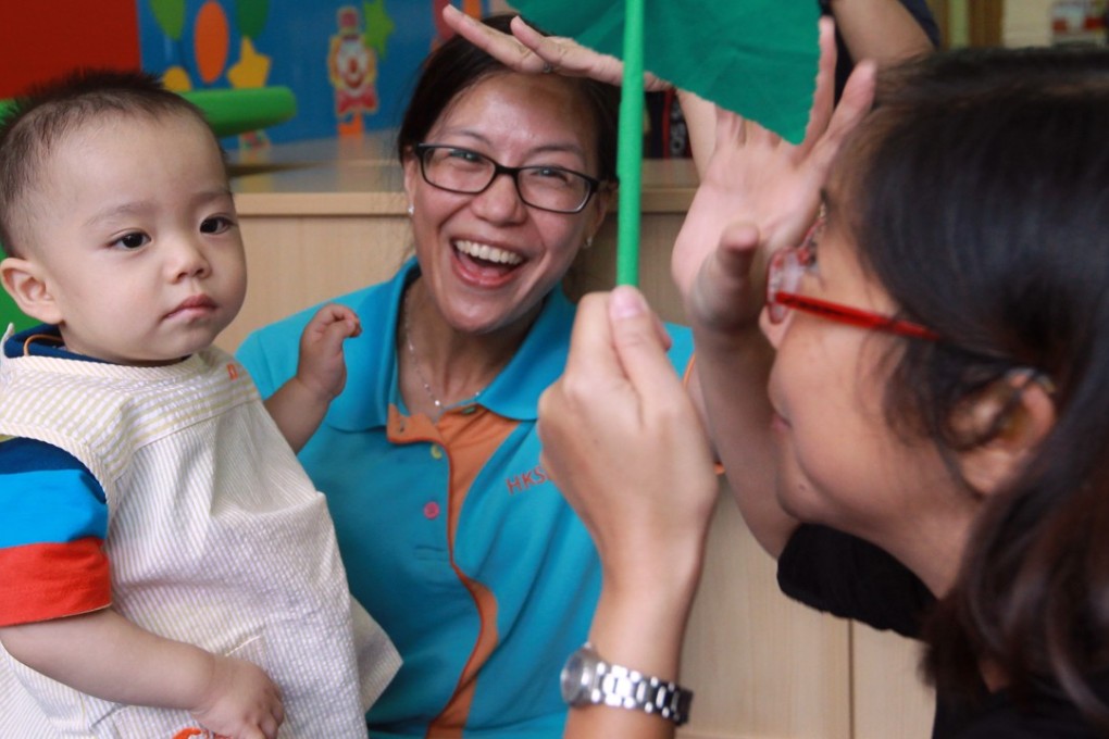 A hearing-impaired baby attends a bilingual (sign language and spoken language) programme at a Hong Kong Society for the Protection of Children creche, in Mong Kok in 2014. Photo: Edward Wong
