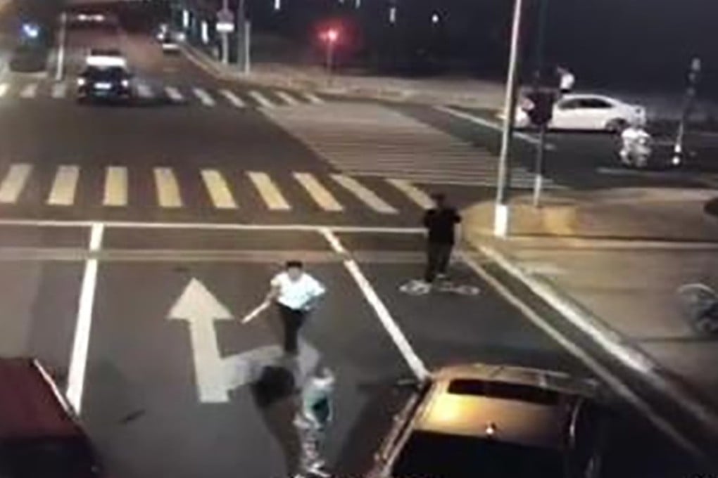 In surveillance footage of the incident, cyclist Yu Haiming pursues motorist Liu Hailong. Photo: Weibo