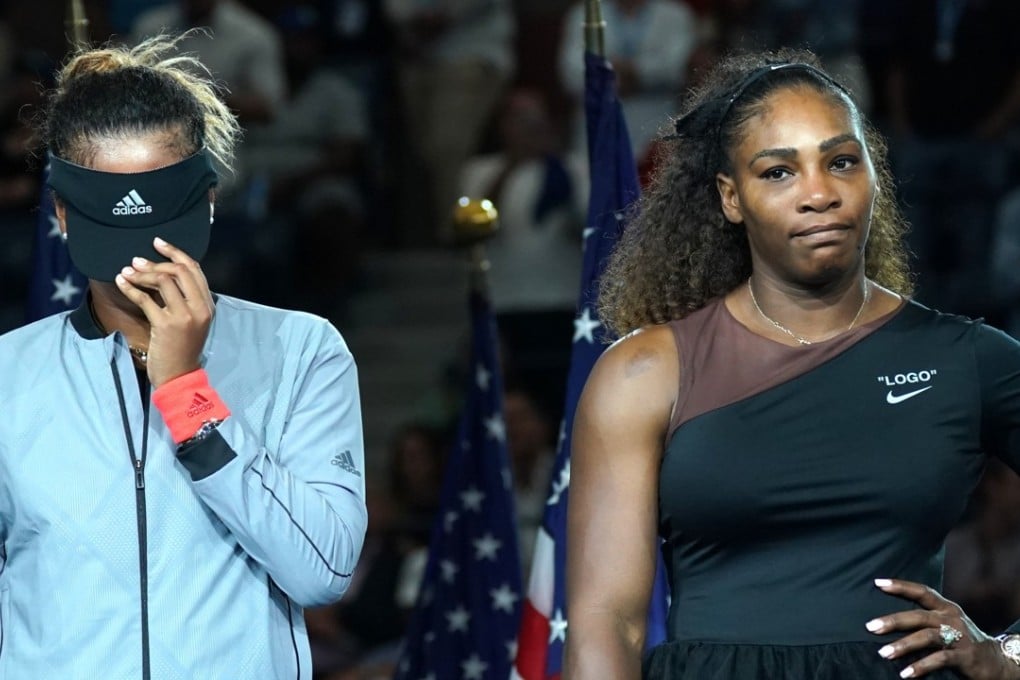 US Open champion Naomi Osaka hides her face as Serena Williams reflects on her performance and behaviour. Photo: AFP