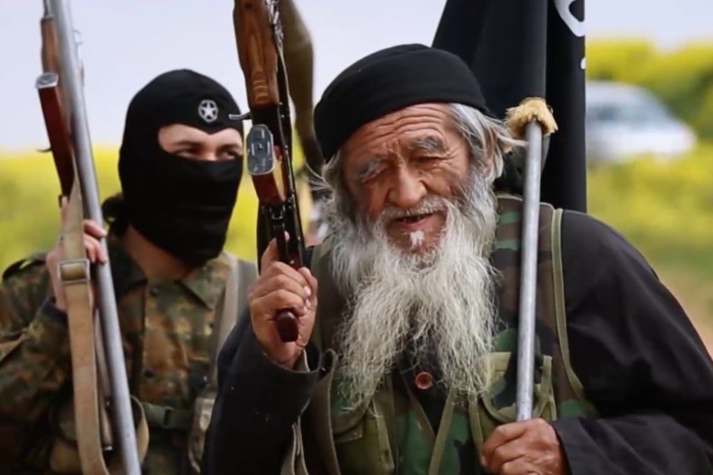 Muhammed Amin, 80-year-old Islamic State fighter, and reportedly a member of China’s Uygur minority, is seen with another IS member in Syria, in this image from a 2015 propaganda video. Photo: Handout